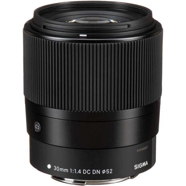 The lens has a fixed focal length of 30mm, making it a versatile standard lens suitable for a variety of photographic genres